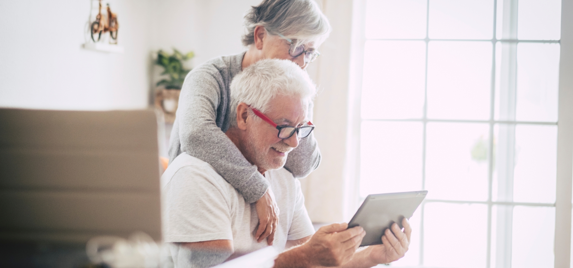 What does it cost? couple looking at a tablet