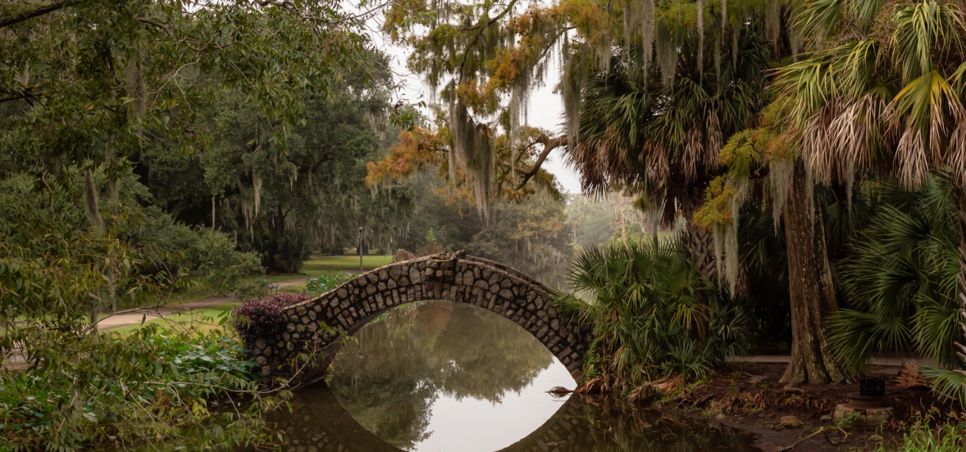 Bridge over a river duing a foggy morning. Taken in City Park, New Orleans, Louisiana, United States.