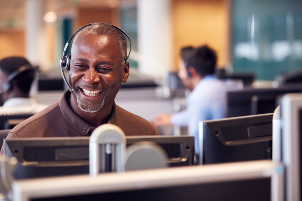 friendly man in guest relations laughing with a customer